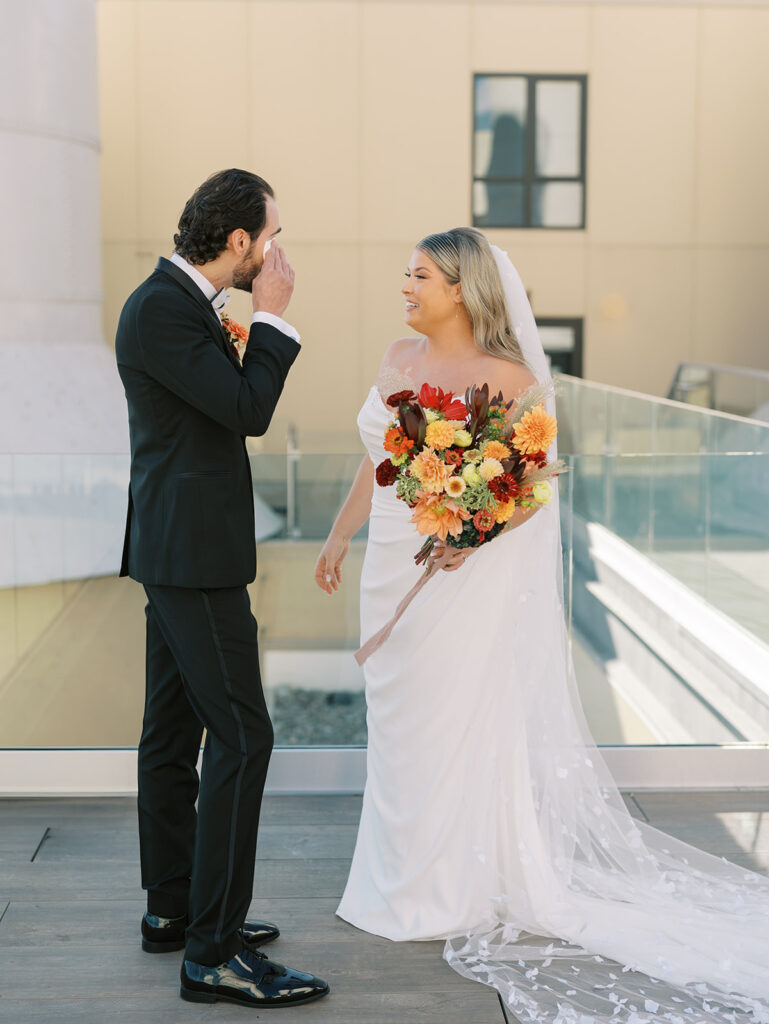 groom crying during first look with bride
