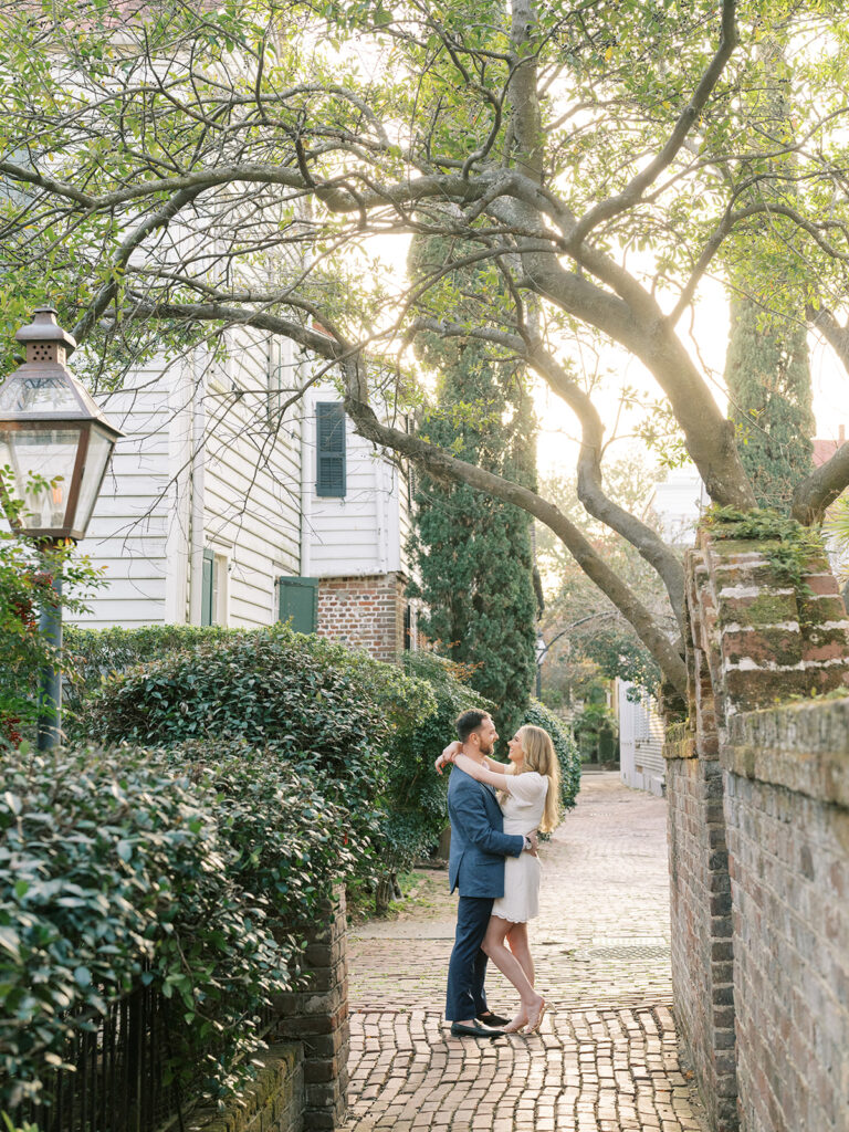 couple embracing during engagement session in Stoll's Alley