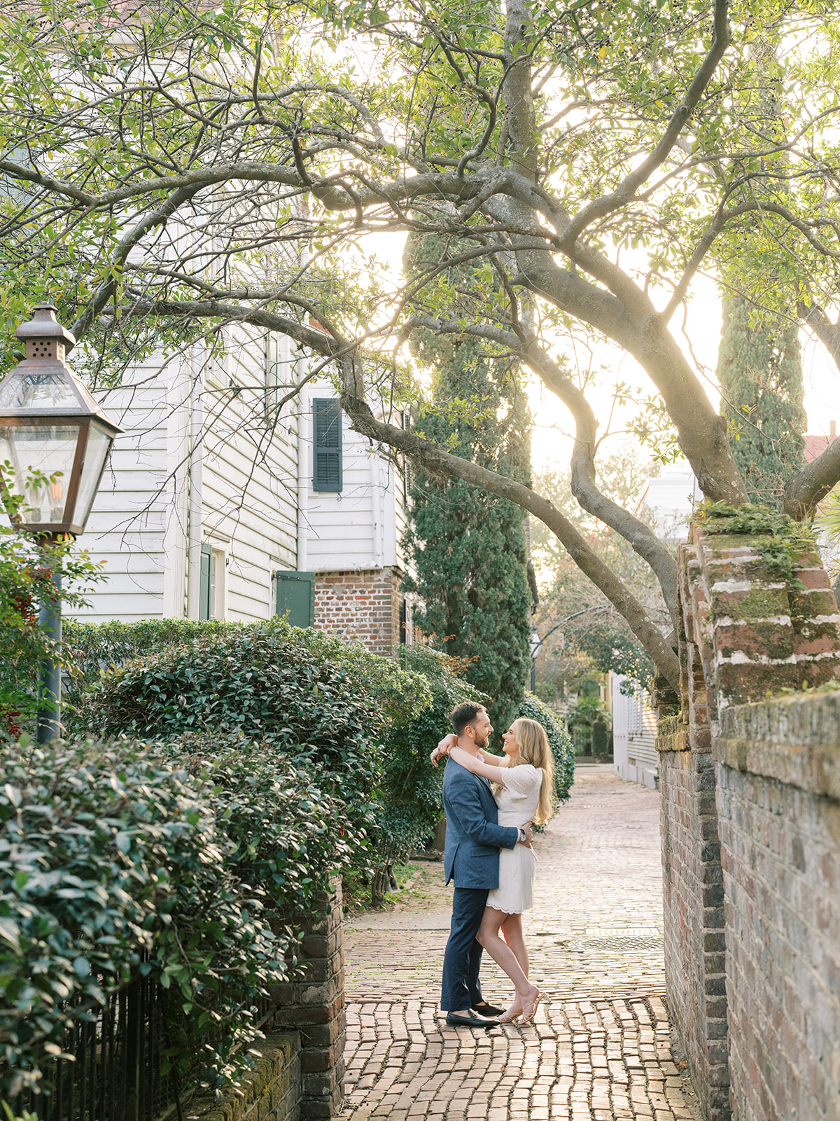 Best Charleston Engagement Photo Locations couple dancing in Stoll's Alley